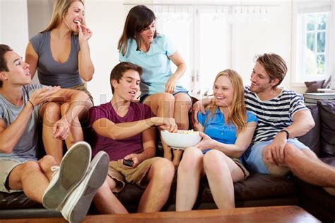 Group Of Friends Relaxing On Sofa At Stock Image Colourbox