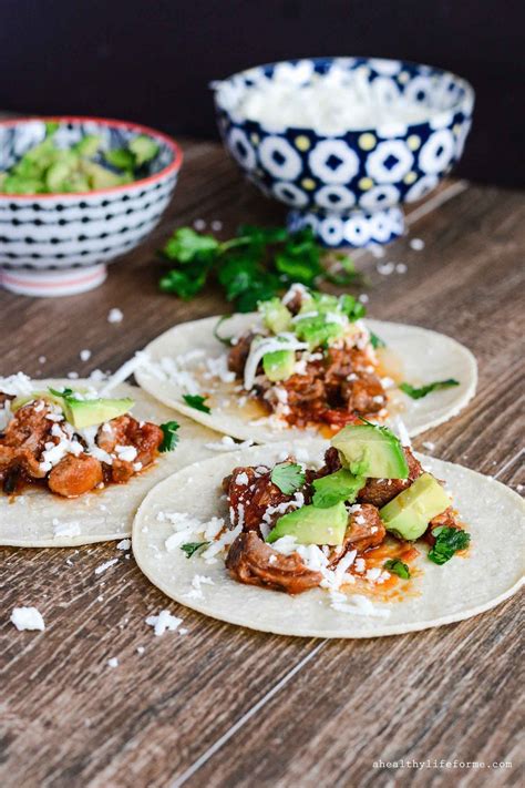 Sweet barbecue pulled pork made in the instant pot or slow cooker piled high on top of a cool, crunchy layer of coleslaw in a lettuce wrap. Pulled Pork Tacos {gluten free} - A Healthy Life For Me