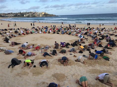Australians Put Heads In The Sand For Bondi Beach Climate Protest