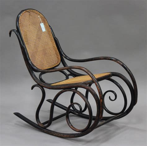 An Early 20th Century Thonet Style Bentwood Rocking Armchair With Caned