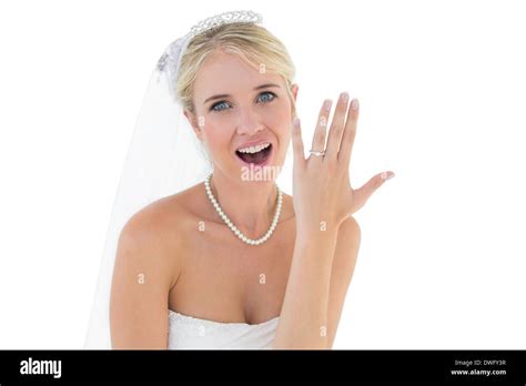 Surprised Bride Showing Wedding Ring Over White Background Stock Photo