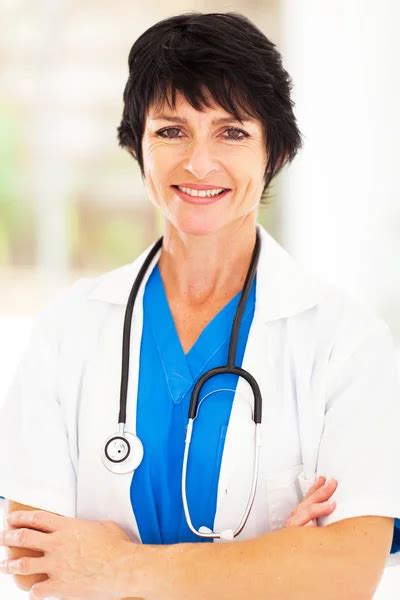 Beautiful Female Middle Aged Doctor Stock Photo By ©michaeljung 21177167
