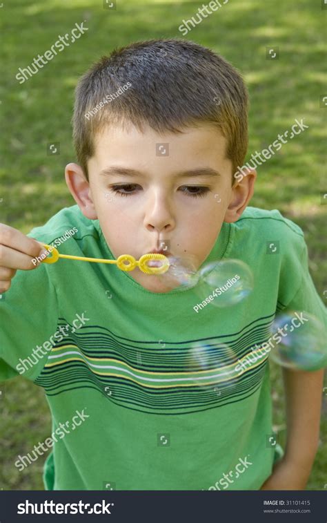 Little Boy Blowing Bubbles Outside Stock Photo 31101415 Shutterstock