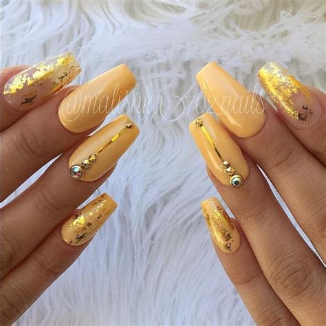 23 Unique Acrylic Nails Yellow - 5af ... One accent nail has a gem design while the other is silver glitter.
