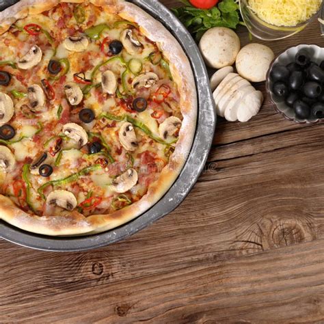 Freshly Baked Pizza With Ingredients And Copyspace Stock Photo Image