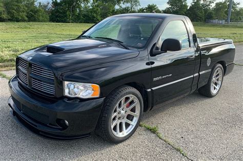 As with other srts, the suspension was updated to handle the power the hard rear tonneau cover helps aerodynamics and keeps the rear of the ram cool looking; 19k-Mile 2005 Dodge Ram SRT-10 6-Speed for sale on BaT ...