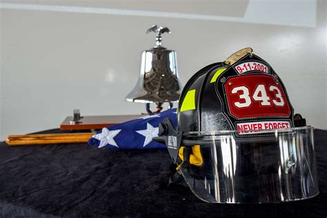 A Helmet And Bell Are Front And Center At A 911 Remembrance Nara