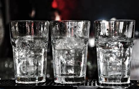 Three Vodka Glasses On The Bar With Lots Of Ice Stock Image Image Of