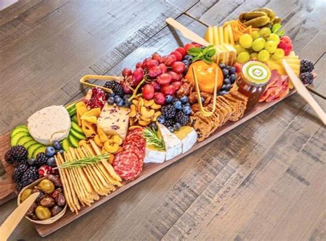 Charcuterie is a french term for a branch of cooking devoted to prepared meat products, such as bacon, ham, sausage, terrines, galantines, ballotines, pâtés, and confit, primarily from pork. Rustic charcuterie board Serving board Cheese tray | Etsy ...