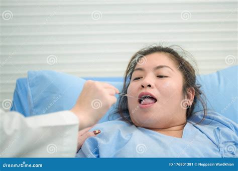 Young Inexperienced Female Doctor Taking Care of a Fat Sick Woman on