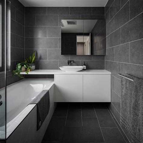 Incorporating the colors black and white with charcoal gray in a bathroom can make it look beautiful. The Dept. of Design Canberra - a residential bathroom interior featuring one of our charcoal ...