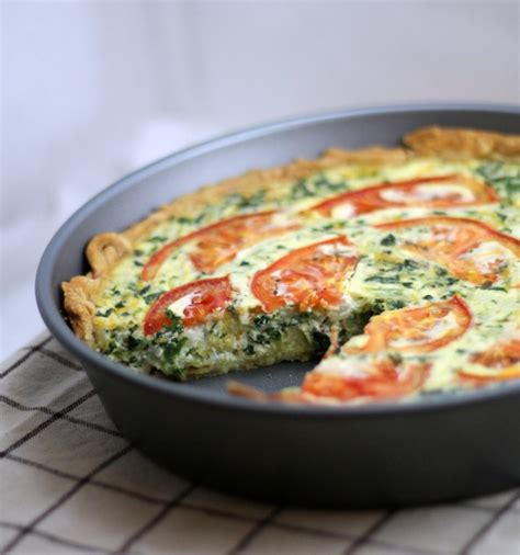 Then layer the fresh spinach, turkey bacon and cheese atop the crust, and then pour the egg mixture over it all. Tomato Bacon Spinach Quiche | This Gal Cooks
