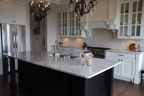 Nantucket kitchen island is constructed of hardwood solids and engineered woods in a sanded and distressed white finish providing an aged worn look. White cabinets, black island (With images) | Kitchen decor ...