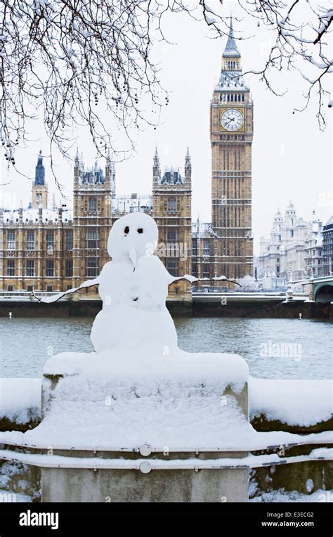 Snowman In Front Of The Houses Of Parliament And Big Ben London