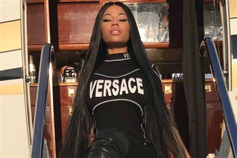 Nicki Minaj Poses On A Private Jet In Thigh High Studded Boots