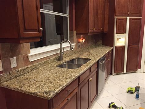 Vicki bodine example of a large country medium tone wood floor kitchen design in new york with a. Santa Cecilia Granite Countertops Installation Kitchen