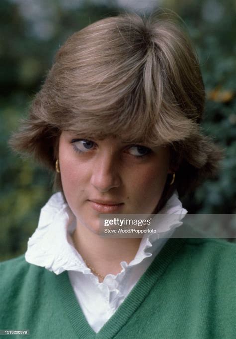 A Portrait Of Lady Diana Spencer Wearing A Green Cardigan With A