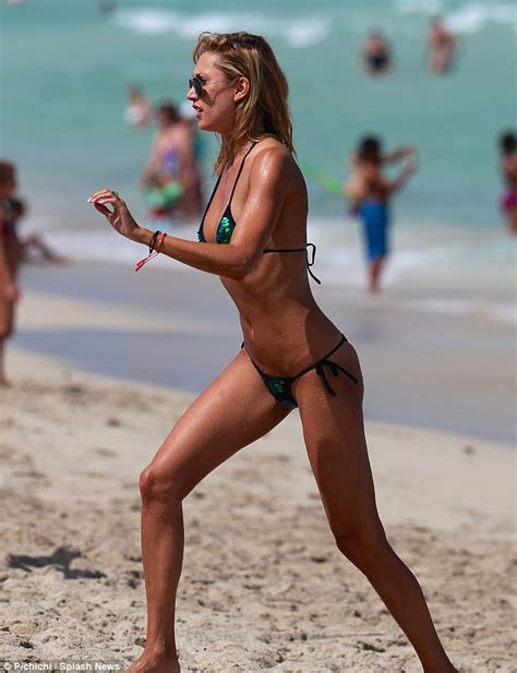 lauren stoner shows off her enviable bikini body in emerald two piece on miami beach daily