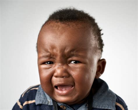 Background Of The Cute Baby Sad Face Stock Photos Pictures And Royalty