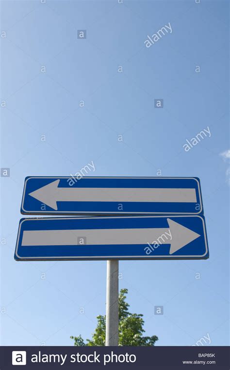 Road Sign With Two One Way Signs Indicating Opposite Directions Stock