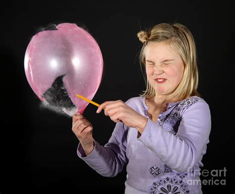 Girl Popping A Balloon Photograph By Ted Kinsman Fine Art America