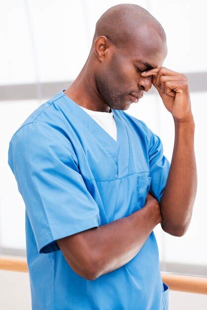 Premium Photo Feeling Tired After Long Surgery Portrait Of Depressed Young African Doctor In