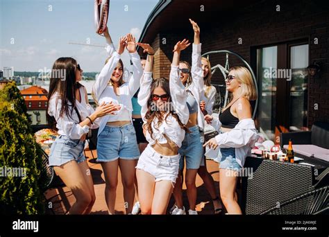 Happy And Cheerful Group Of Women Friends Together Dancing And Having