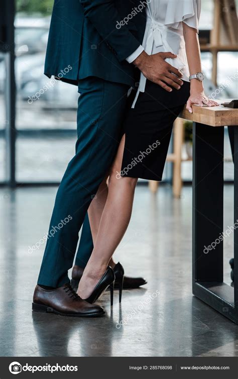 Cropped View Businessman Standing Touching Businesswoman While Flirting