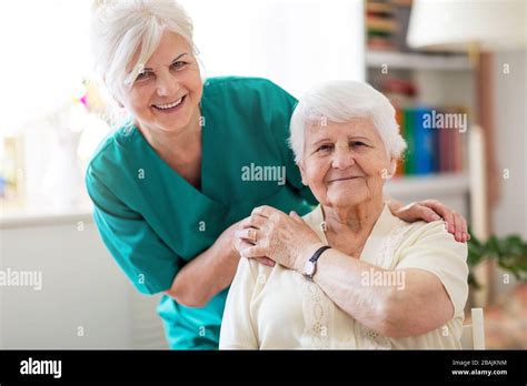 Home Caregiver With Senior Adult Woman Stock Photo Alamy