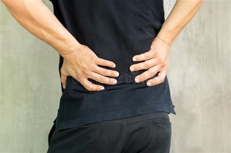 Man With Back Pain Isolated On Grey Background Stock Image Image Of