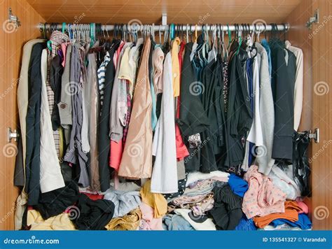 Pile Of Messy Clothes In Closet Untidy Cluttered Woman Wardrobe
