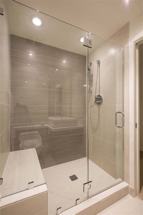 This Modern Bathroom Has A Large Glass Enclosed Shower In Tile The Shower Stall Includes A B