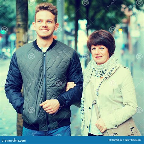 Mature Woman And Guy Taking Walk Stock Image Image Of Pedestrian