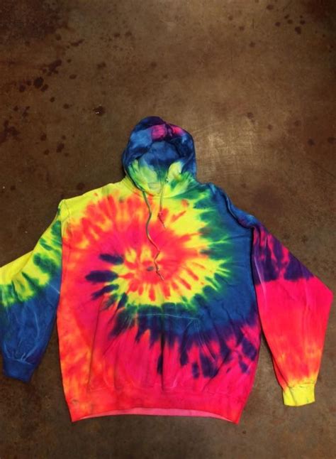 Add in the rising popularity of tie dye lately, and this tie dye hoodie project is perfect for the teens in your life. Tie Dye Neon Spiral Hoodie (With images) | Tie dye crafts, Tie dye hoodie, Tie dye diy