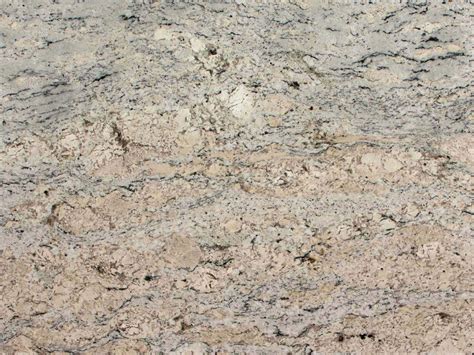 White ice granite is a combination of steel gray and bright white speckled with black and varying shades of gray. White Ice Granite | Granite Countertops | Granite Slabs