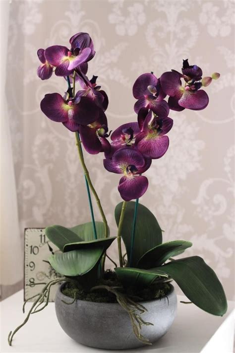 Durable plastic foliage and trees make ideal outdoor decorations, while more delicate foam or silk flowers are perfect for a small bunch of flowers to either walk down the aisle or to brighten a room in a vase. Auctiva Image Hosting | Orchid flower arrangements, Purple ...