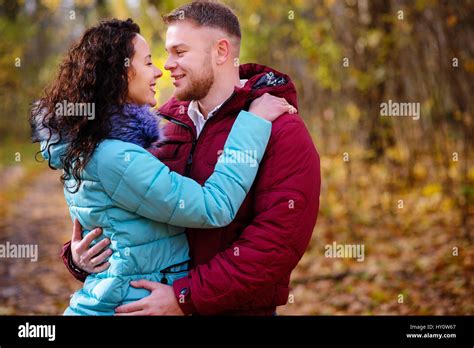Portrait Of Young Loving Couple Kissing In Autumn Park Stock Photo Alamy