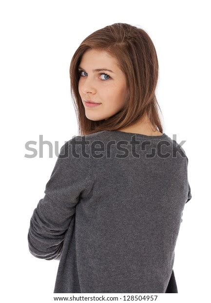 Attractive Teenage Girl Looking Over Shoulder Stock Photo 128504957