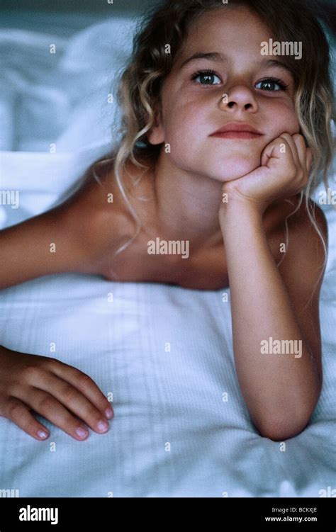 Girl Lying In Bed Leaning On Elbow Stock Photo Alamy