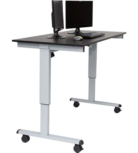 Whenever you've sat too long, up it goes. Motorized Standing Desk in Computer and Laptop Carts