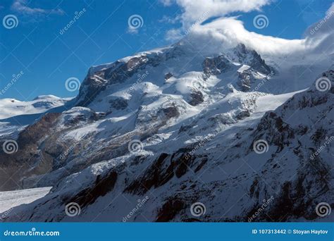 Winter Panorama Of Mount Matterhorn Covered With Clouds Alps