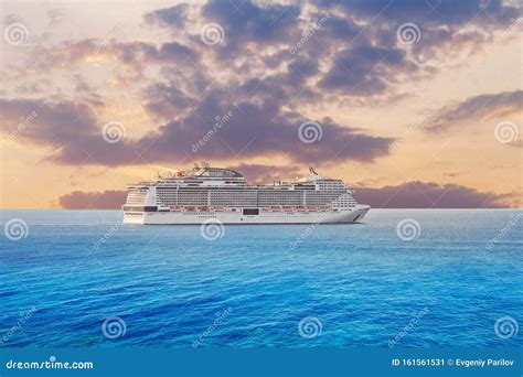 Luxury Cruise Ship Vacation In Blue Azure Sea Sky With Clouds Sunset