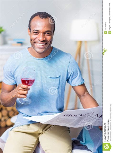 A wine bottle is a bottle, generally a glass bottle, that is used for holding wine.some wines are fermented in the bottle while others are bottled only after fermentation. Joyful Nice Man Holding A Glass Of Wine Stock Image - Image of masculine, casual: 108860847