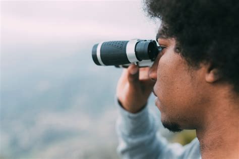 Free Photo Man Looking Through Binoculars