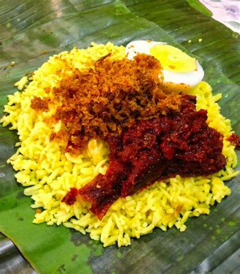 It is quite a production to prepare this dish, since nasi kuning (or yellow rice) is traditionally served with the requisite perkedel kentang, ayam ungkep, telur dadar gulung, kerupuk udang (shrimp crackers), quick lalap, and sambal. Sabah Yellow Rice (Nasi Kuning)