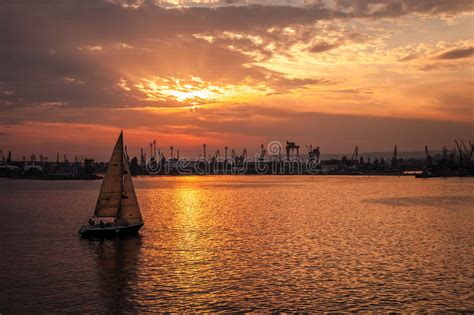 Sailing Yacht Enters The Harbor At Sunset Varna Stock Image Image Of