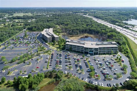 Aerial View Of An Suburban Office Park With Parking Lot And Adjacent