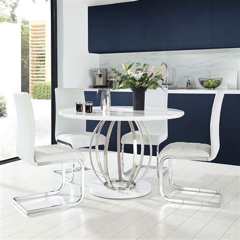Choosing your dining table design sets the tone for the whole room, so make sure you choose wisely. Savoy Round White High Gloss and Chrome Dining Table with ...