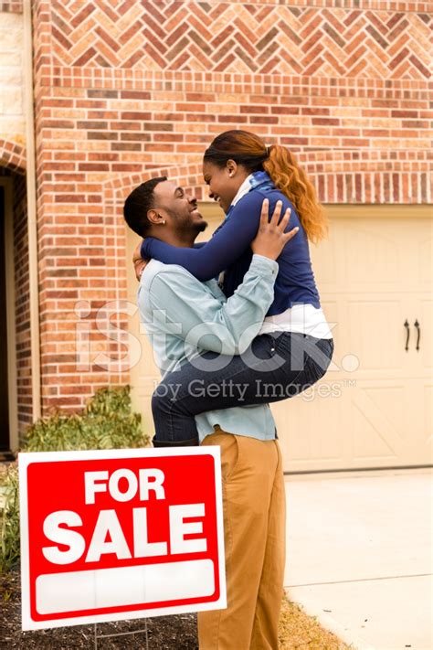 Real Estate African Descent Couple Jumps For Joy First Home Stock