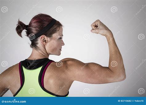 Woman Flexing Back Muscles 1 These Include The Biceps Brachii